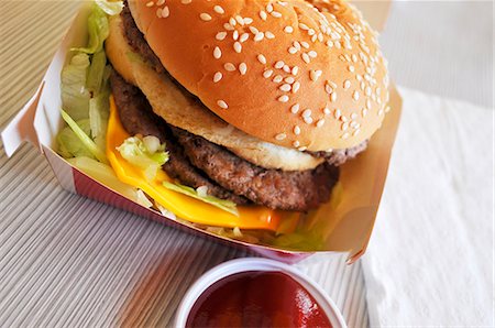 restaurant burger - Hamburger on plate in restaurant Stock Photo - Premium Royalty-Free, Code: 659-06184190