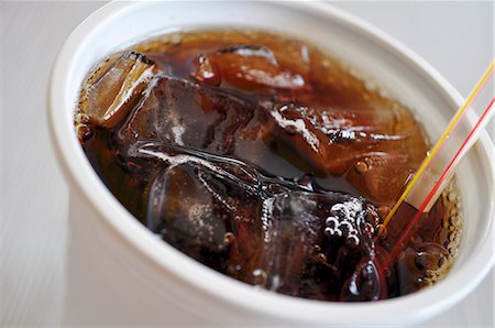 straw in drink - Cola in a plastic cup with ice Stock Photo - Premium Royalty-Free, Code: 659-06184192