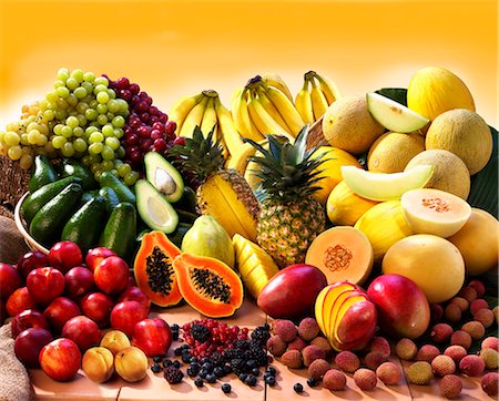 fruit still life - Display of exotic fruit with stone fruits, berries and avocados Foto de stock - Sin royalties Premium, Código: 659-06184232