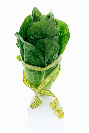 simsearch:659-07028592,k - Une laitue de cos avec un ruban à mesurer Photographie de stock - Premium Libres de Droits, Code: 659-06184410