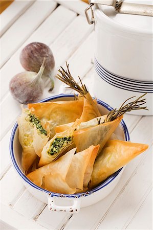 simsearch:659-07959775,k - Greek samosas (feta-spinach filling and fig-walnut filling) Stock Photo - Premium Royalty-Free, Code: 659-06184425