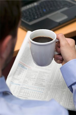 desk directly above - Businessman drinking coffee while reading newspaper in office Stock Photo - Premium Royalty-Free, Code: 659-06184440