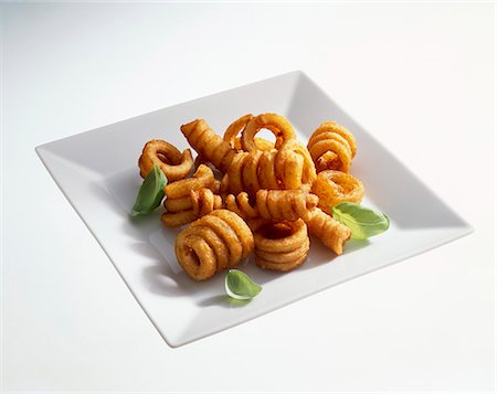 simsearch:659-01864492,k - Deep-fried potato spirals Foto de stock - Sin royalties Premium, Código: 659-06184488