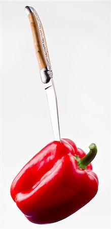 simsearch:659-06306189,k - Knife sticking into a red pepper Stock Photo - Premium Royalty-Free, Code: 659-06185019