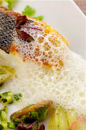 simsearch:659-06185095,k - Fried branzino (sea bass) with spring vegetables and foam sauce Stock Photo - Premium Royalty-Free, Code: 659-06185096