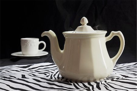 White Tea Pot and Tea Cup on Zebra Pattern Cloth Stock Photo - Premium Royalty-Free, Code: 659-06185357