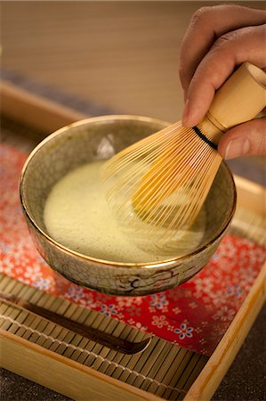 simsearch:659-06307520,k - Mixing Japanese Matcha Green Tea in a Ceremonial Bowl with Whisk Stock Photo - Premium Royalty-Free, Code: 659-06185654