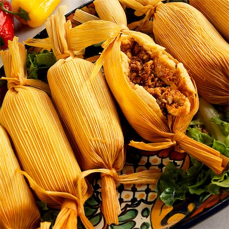 Serving Platter of Meat Filled Tamales; One Cut Open Stock Photo - Premium Royalty-Free, Code: 659-06185658