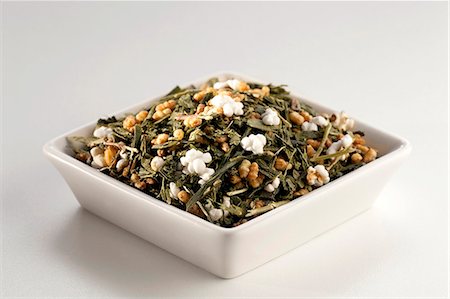 simsearch:659-06494422,k - Japanese Gen Mai Cha Loose Green Tea in a White Dish; White Background Stock Photo - Premium Royalty-Free, Code: 659-06185650