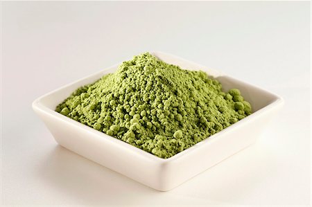 Japanese Matcha Green Tea Powder in a White Dish; White Background Stock Photo - Premium Royalty-Free, Code: 659-06185652