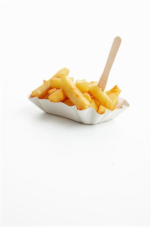 fried food - Chips on a takeaway paper plate Stock Photo - Premium Royalty-Free, Code: 659-06185760