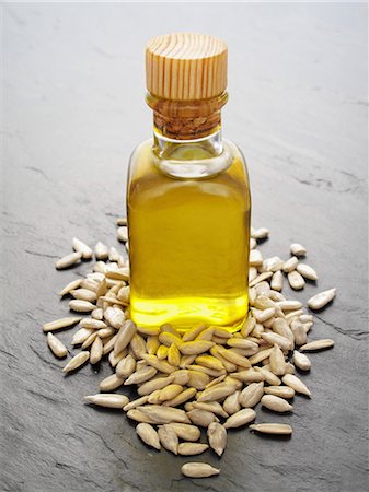 stone slab - Sunflower oil and sunflower seeds Stock Photo - Premium Royalty-Free, Code: 659-06185810