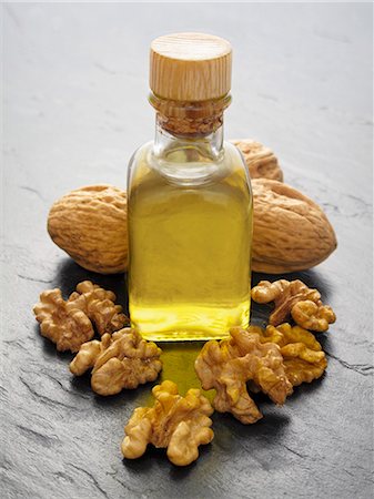 stone slab - Walnut oil, walnuts and walnuts in shells Stock Photo - Premium Royalty-Free, Code: 659-06185822