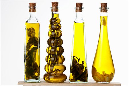 Bottles of olive oil with various aromas Stock Photo - Premium Royalty-Free, Code: 659-06185970