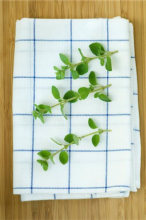 Oregano sprigs on a tea towel Stock Photo - Premium Royalty-Free, Code: 659-06186031