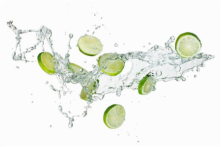 Slices of lime in water Stock Photo - Premium Royalty-Free, Code: 659-06186054