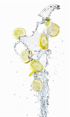 Lemon slices and a splash of water Stock Photo - Premium Royalty-Free, Code: 659-06186065