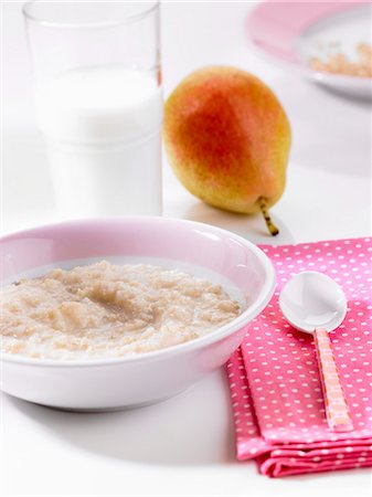 pear dessert - Rice pudding and a pear Stock Photo - Premium Royalty-Free, Code: 659-06186118