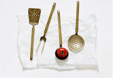 strainer - Various old kitchen utensils and a tomato Stock Photo - Premium Royalty-Free, Code: 659-06186222