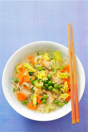 Noodle soup with chicken, celery, carrots and peas (Asia) Stock Photo - Premium Royalty-Free, Code: 659-06186257