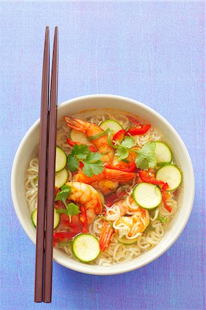 Spicy noodle soup with shrimps, chillis, courgette and coriander (Asia) Stock Photo - Premium Royalty-Free, Code: 659-06186258