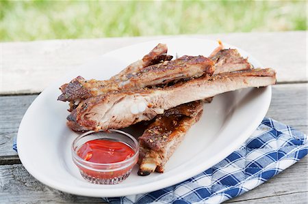 Grilled spare ribs and barbecue sauce Fotografie stock - Premium Royalty-Free, Codice: 659-06186389