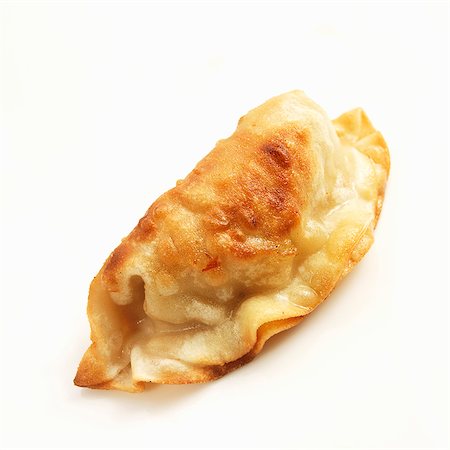 simsearch:659-06903223,k - One Potsticker on a White Background Stock Photo - Premium Royalty-Free, Code: 659-06186486