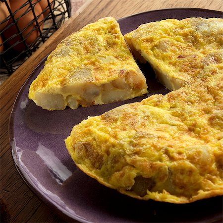 egg dish - Tortilla Espanola; Spanish Omelet with Potatoes and Onions Stock Photo - Premium Royalty-Free, Code: 659-06186490