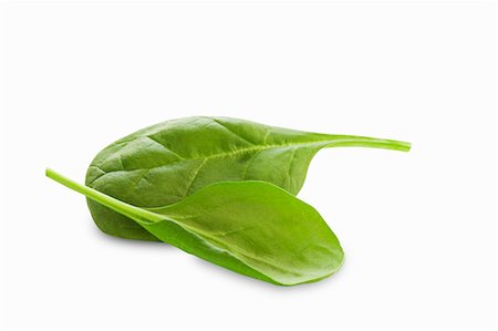 espinaca - Two Baby Spinach Leaves on a White Background Foto de stock - Sin royalties Premium, Código: 659-06186566