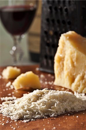 Grated Romano Cheese with Cheese Grater and Glass of Red Wine Stock Photo - Premium Royalty-Free, Code: 659-06186791