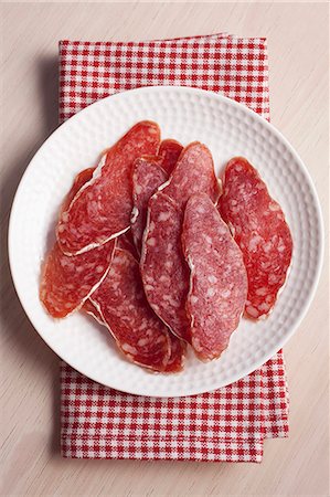 salami slice - Slices of fuet salami Stock Photo - Premium Royalty-Free, Code: 659-06186891