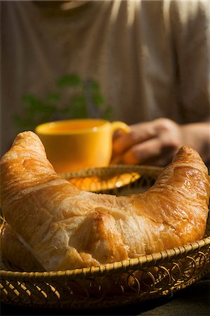 A croissant in a bread basket Stock Photo - Premium Royalty-Free, Code: 659-06186900