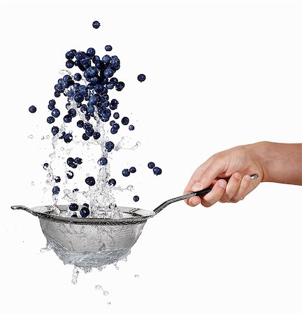 Blueberries being washed in a sieve Stock Photo - Premium Royalty-Free, Code: 659-06187087