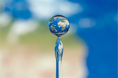 Globe dans une goutte d'eau Photographie de stock - Premium Libres de Droits, Code: 659-06187474