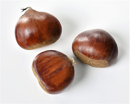 sweet chestnut - Three sweet chestnuts Stock Photo - Premium Royalty-Free, Code: 659-06187541