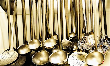 straining spoon - Ladles and strainer spoons in a large kitchen Stock Photo - Premium Royalty-Free, Code: 659-06187746