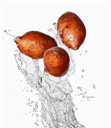 Three sweet potatoes and water Stock Photo - Premium Royalty-Free, Code: 659-06187860