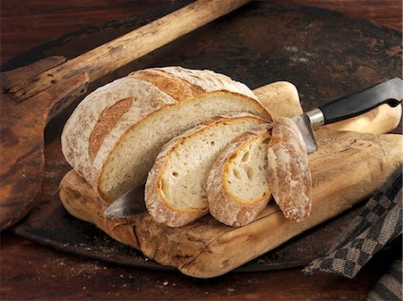 Weizen-Brot mit Hafer schneiden Stockbilder - Premium RF Lizenzfrei, Bildnummer: 659-06187891