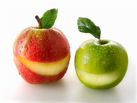 Une rouge et une pomme verte avec une tranche de chacun Photographie de stock - Premium Libres de Droits, Code: 659-06187916