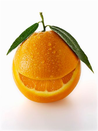 face (object) - One orange with leaves and a slice taken out of it Stock Photo - Premium Royalty-Free, Code: 659-06187910