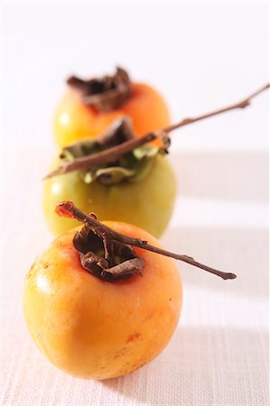 diospyros kaki - Fresh persimmons with twigs Stock Photo - Premium Royalty-Free, Code: 659-06188089