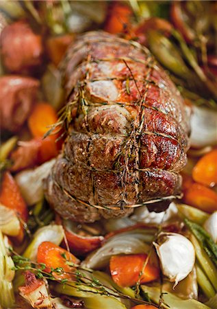 roasted (meat) - Beef shoulder fillet with herbs on a bed of vegetables Stock Photo - Premium Royalty-Free, Code: 659-06188209