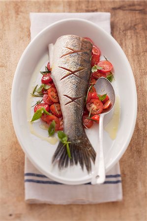 fruit vegetable recipe - Fried fish on a bed of tomatoes Stock Photo - Premium Royalty-Free, Code: 659-06188274
