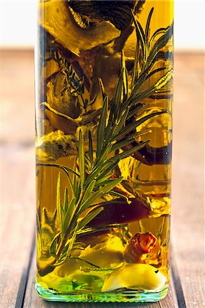 Porcini mushroom oil with herbs and rosemary Stock Photo - Premium Royalty-Free, Code: 659-06188381