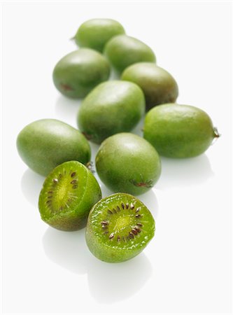 Mini kiwis, whole and halved Stock Photo - Premium Royalty-Free, Code: 659-06188410