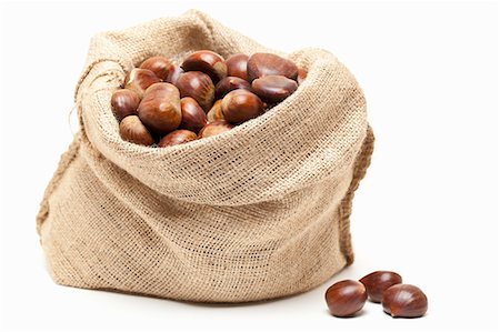 sweet chestnuts - Edible chestnuts in a jute sack Stock Photo - Premium Royalty-Free, Code: 659-06188445