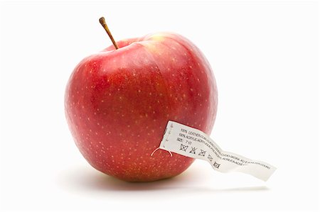 simsearch:659-06155344,k - Une pomme avec une étiquette d'entretien (une icône pour la nourriture synthétiquement créé) Photographie de stock - Premium Libres de Droits, Code: 659-06188449