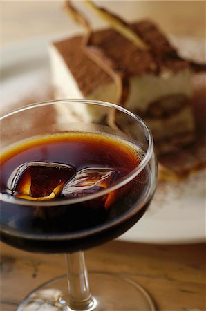 simsearch:659-03526565,k - A glass of Tia Maria (coffee liqueur) and tiramisu Stock Photo - Premium Royalty-Free, Code: 659-06188467
