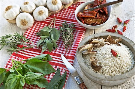 dried tomato - Rice, fresh herbs and spices for Tessin risotto Stock Photo - Premium Royalty-Free, Code: 659-06188590
