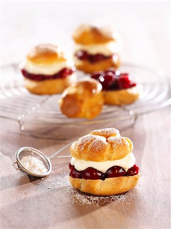 Profiteroles filled with cherries and cream Stock Photo - Premium Royalty-Free, Code: 659-06188604